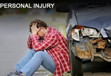Man sitting by car accident