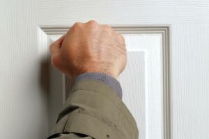 Debt Collector knocking on door